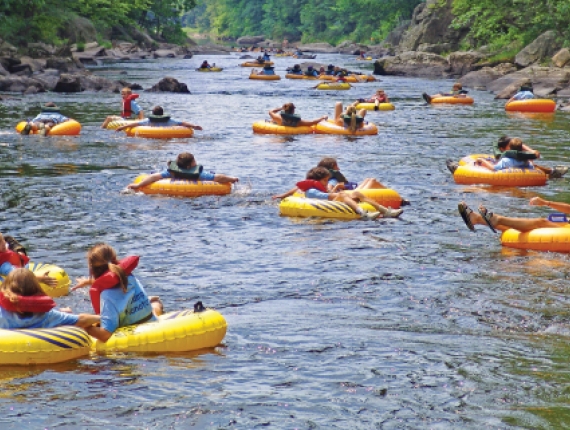 Large group of tubers going down Farmington River at Satan's Kingdom