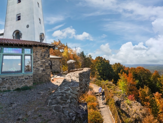 Two people hiking to tower at Talcott Mountain 